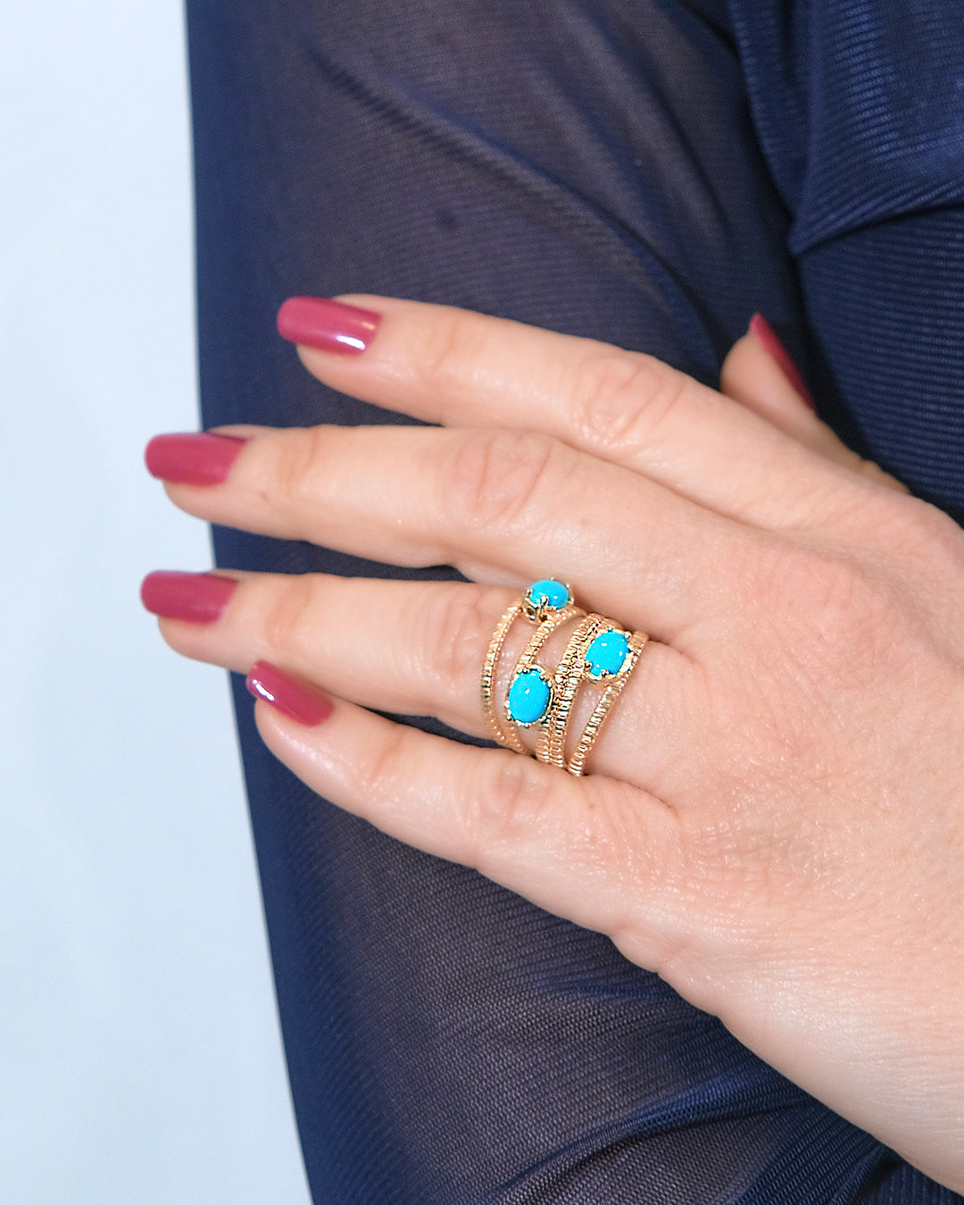 Ring mit 5 Reihen und 3 türkisfarbenen Krappen