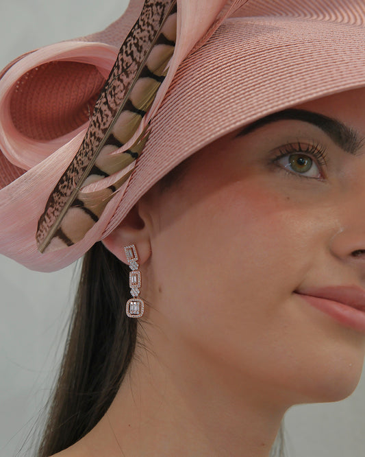 Pendientes largos en plata con baño de rosa con rosetas