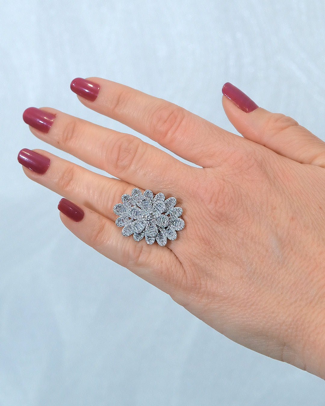 Anillo flor joya en plata orlas oval con circonitas
