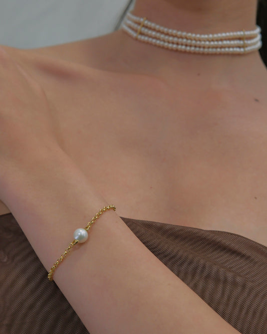 Pulsera eslabones con perla cultivada en el centro