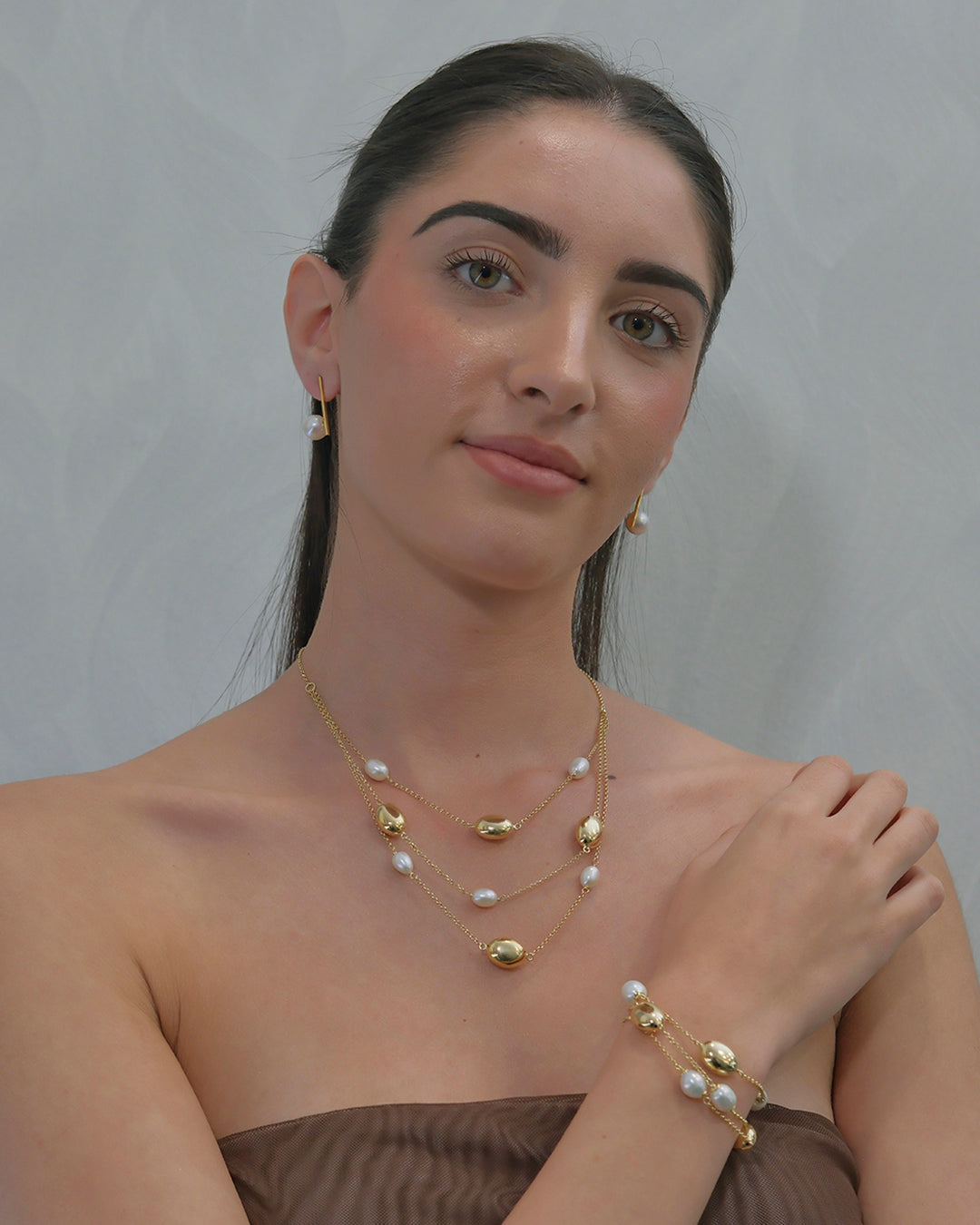 Triple-strand bracelet with pearls and chain links