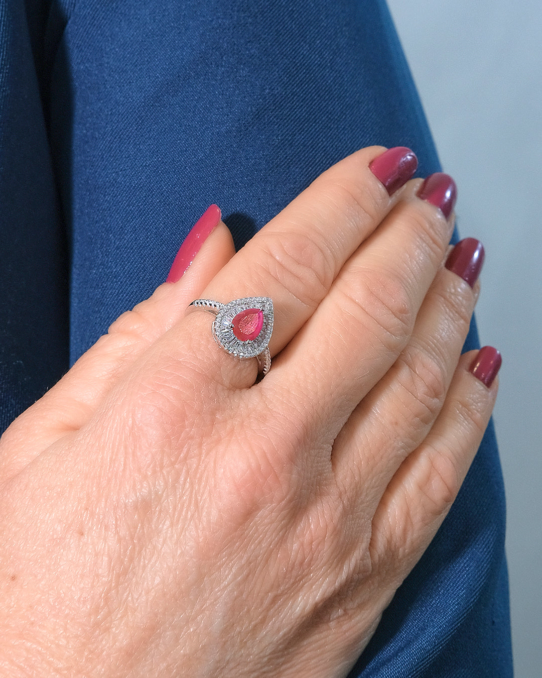 Drop ring with pear-cut ruby centerpiece