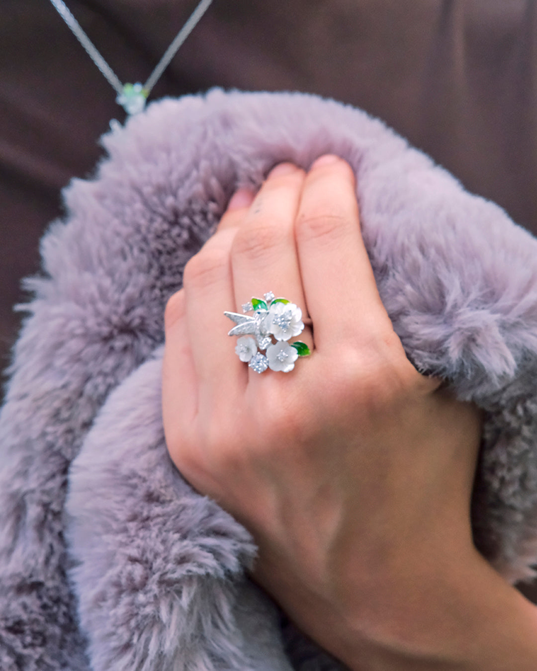 Silver ring with flowers and a little bird 