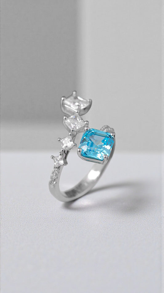 Anillo cruzado con circonitas de colores