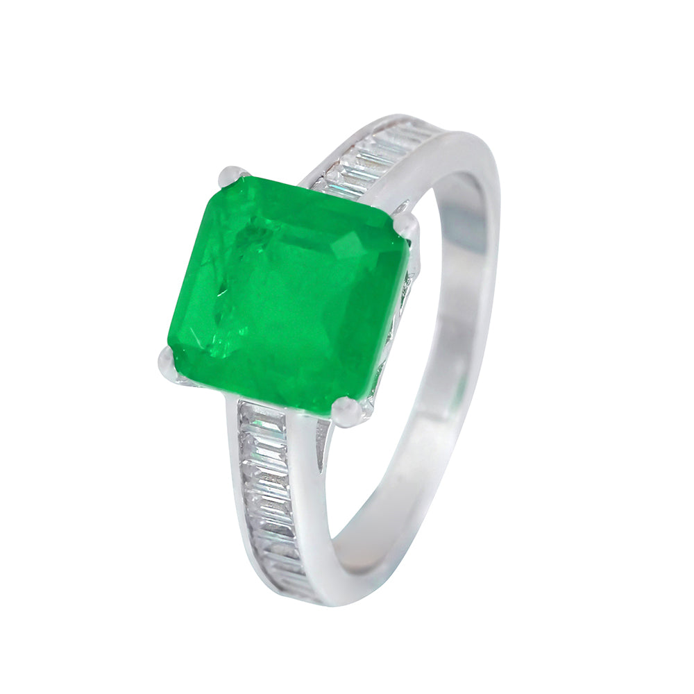 Silver ring with emerald-colored stone 